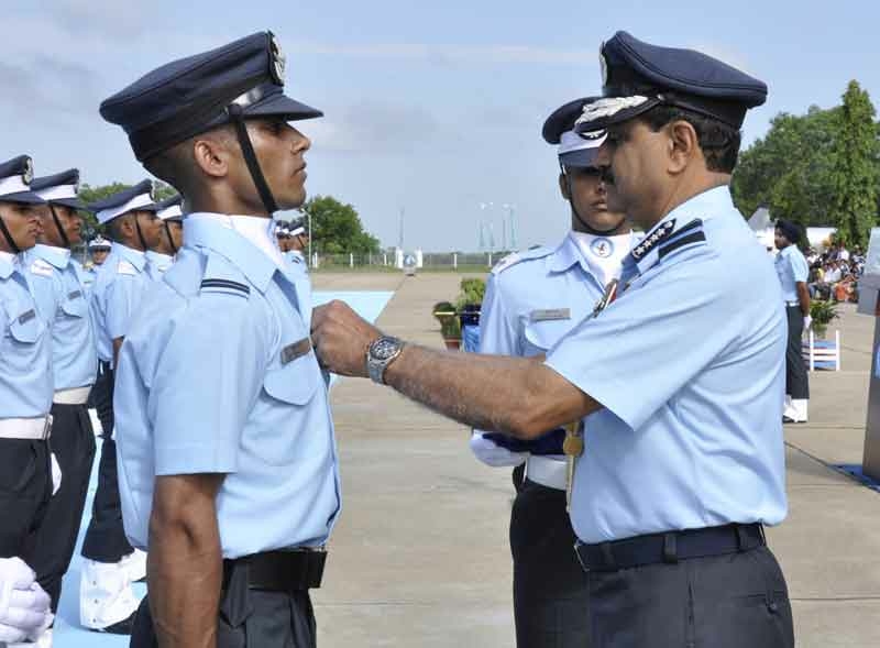 Air Chief Marshal NAK Browne awarding the  ‘Stripes’ and ‘Wings’ to the newly commissioned Flying Officers during the Pipping Ceremony