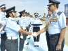 Air Chief Marshal congratulates the newly commissioned Flying Officers 